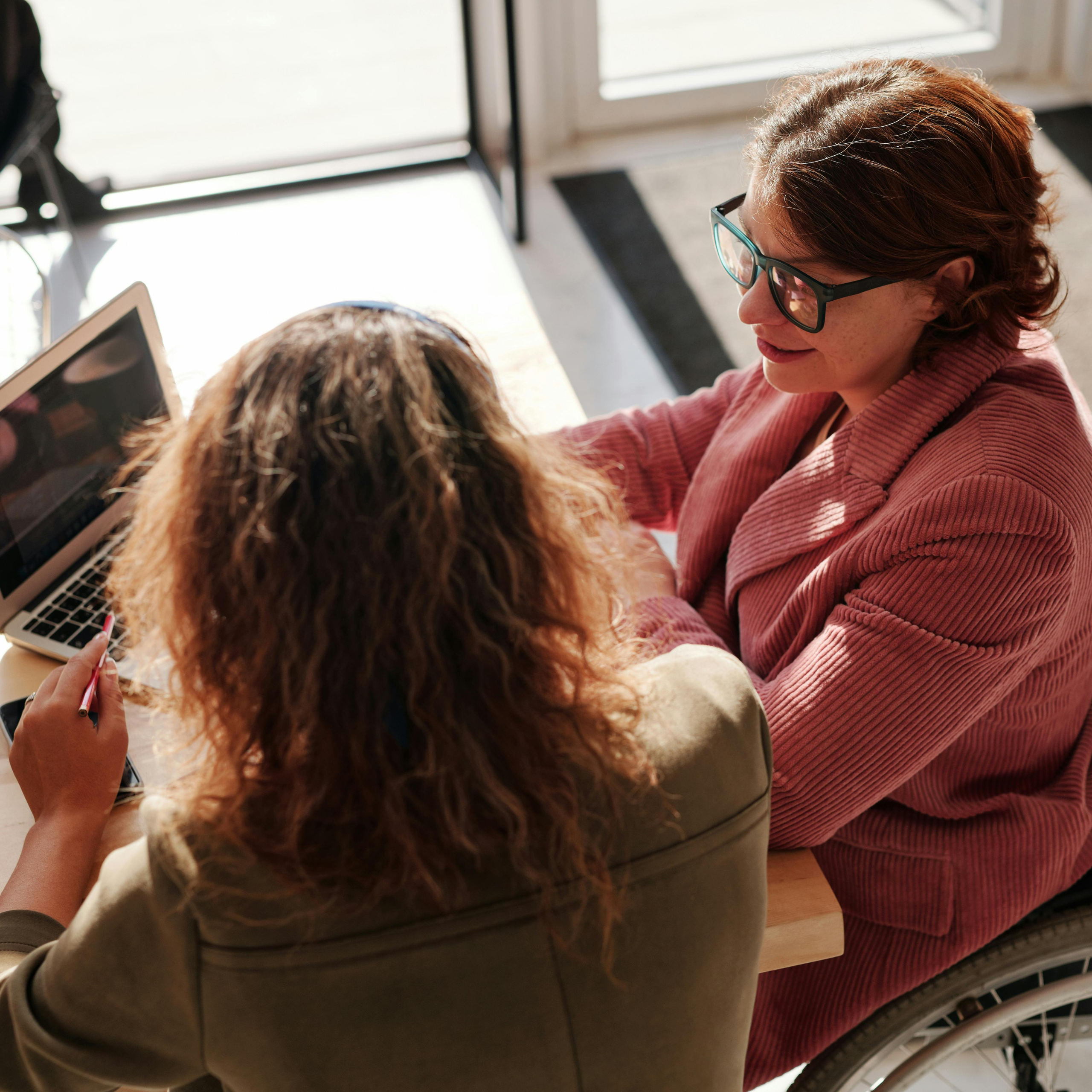 Photo by Marcus Aurelius httpswww.pexels.comphotowoman-in-red-sweater-wearing-black-framed-eyeglasses-sitting-on-wheelchair-4063789